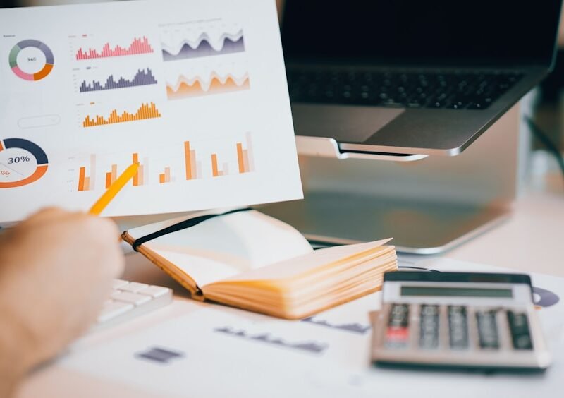 Business owner reviewing growth charts and performance reports